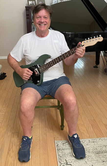 Rich playing the Off T ergonomic guitar sitting