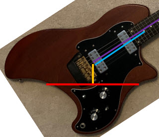 Shows ergonomic measurements for an Ovation Breadwinner Limited guitar played while sitting